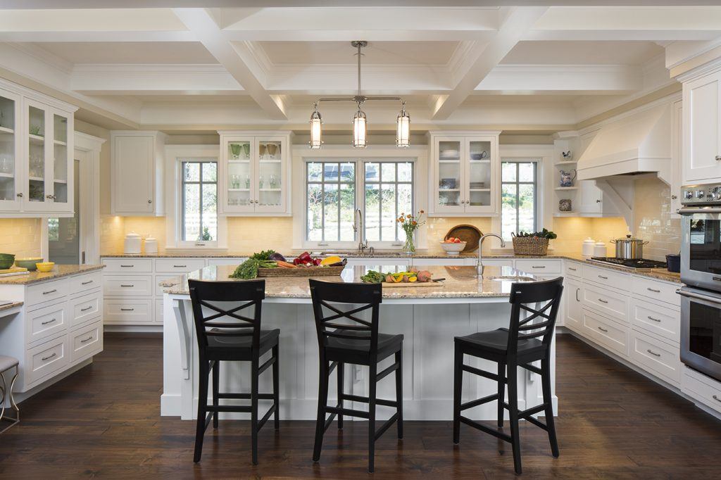 Large kitchen with island and chairs in rebuilding