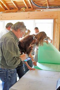 HartmanBaldwin staff presenting new project inside.