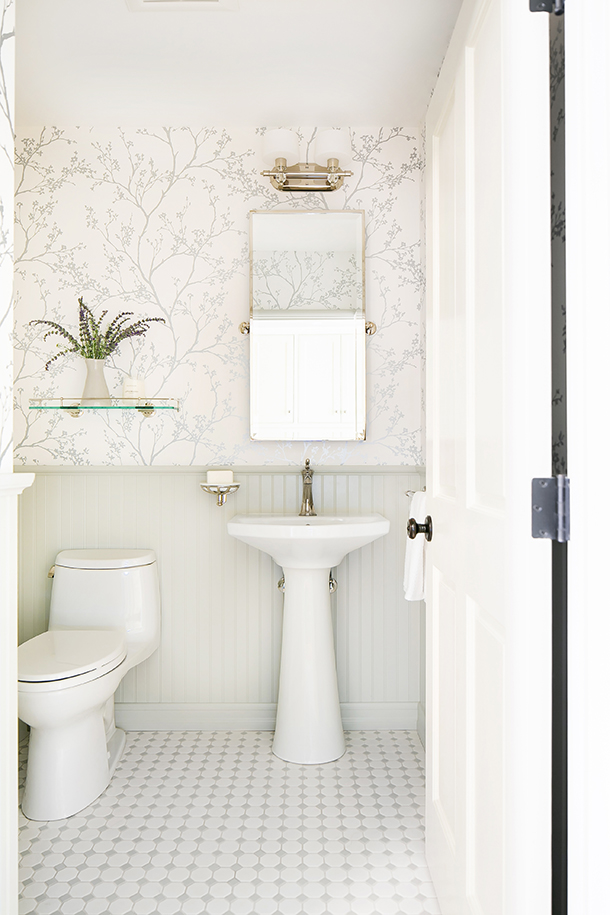 Old English Padua Residence white powder bathroom renovation with delicate branch pattern wallpaper