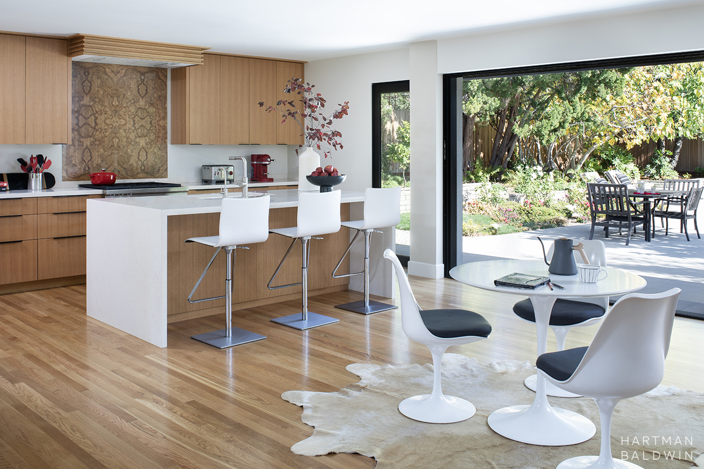 Extensive Mid-Century Modern home reconfiguration and remodel with new kitchen and large sliding glass door to backyard