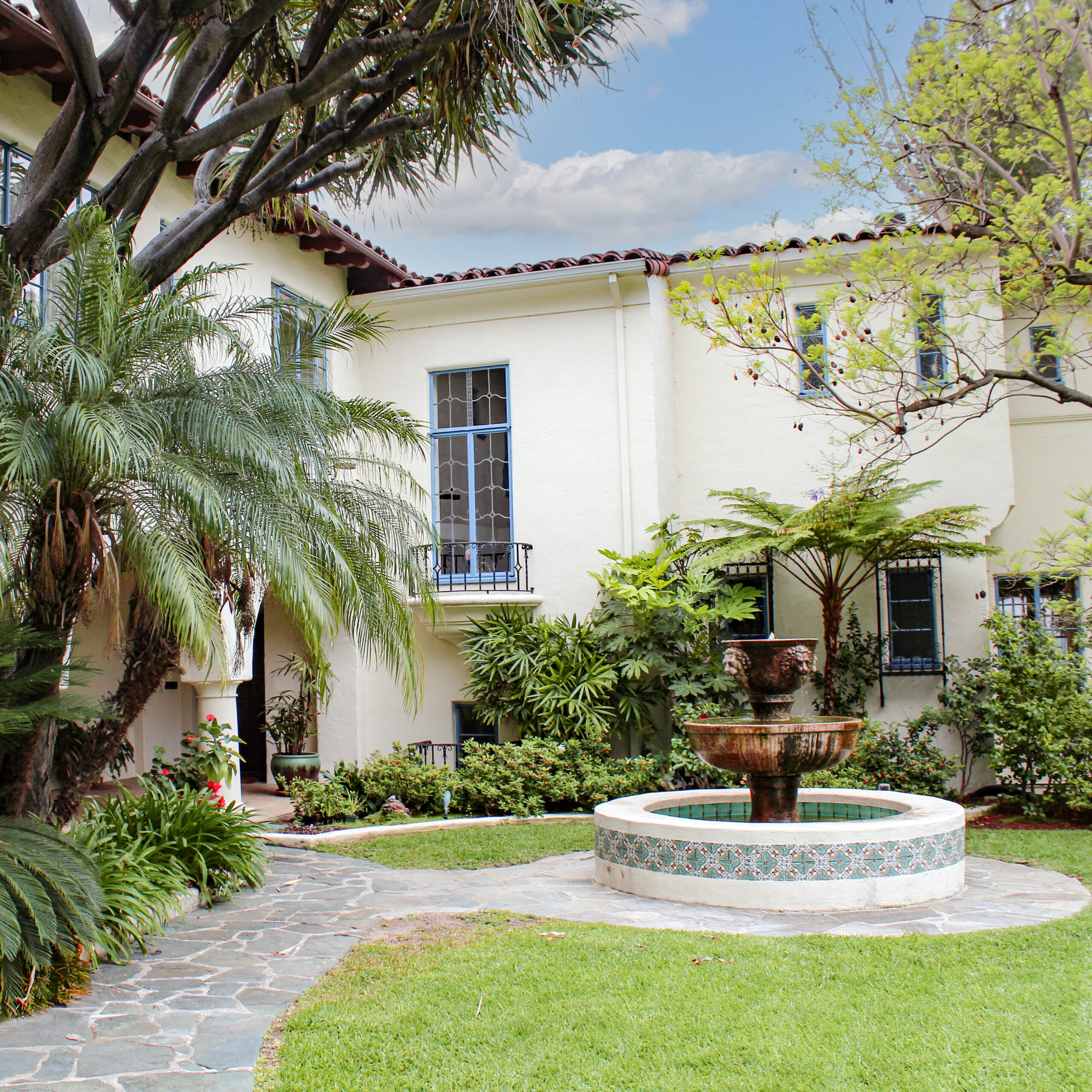 Spanish Revival Home in Southern California Crop - Hartman Baldwin Pre-Launch Spanish-style home and courtyard with water fountain