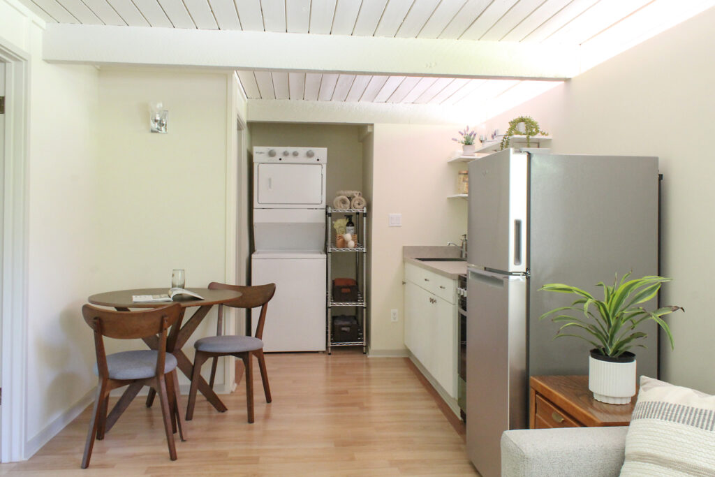 HartmanBaldwin Via Zurita Residence ADU Overall - Hartman Baldwin Pre-Launch ADU interior with kitchen, laundry nook, and dining table