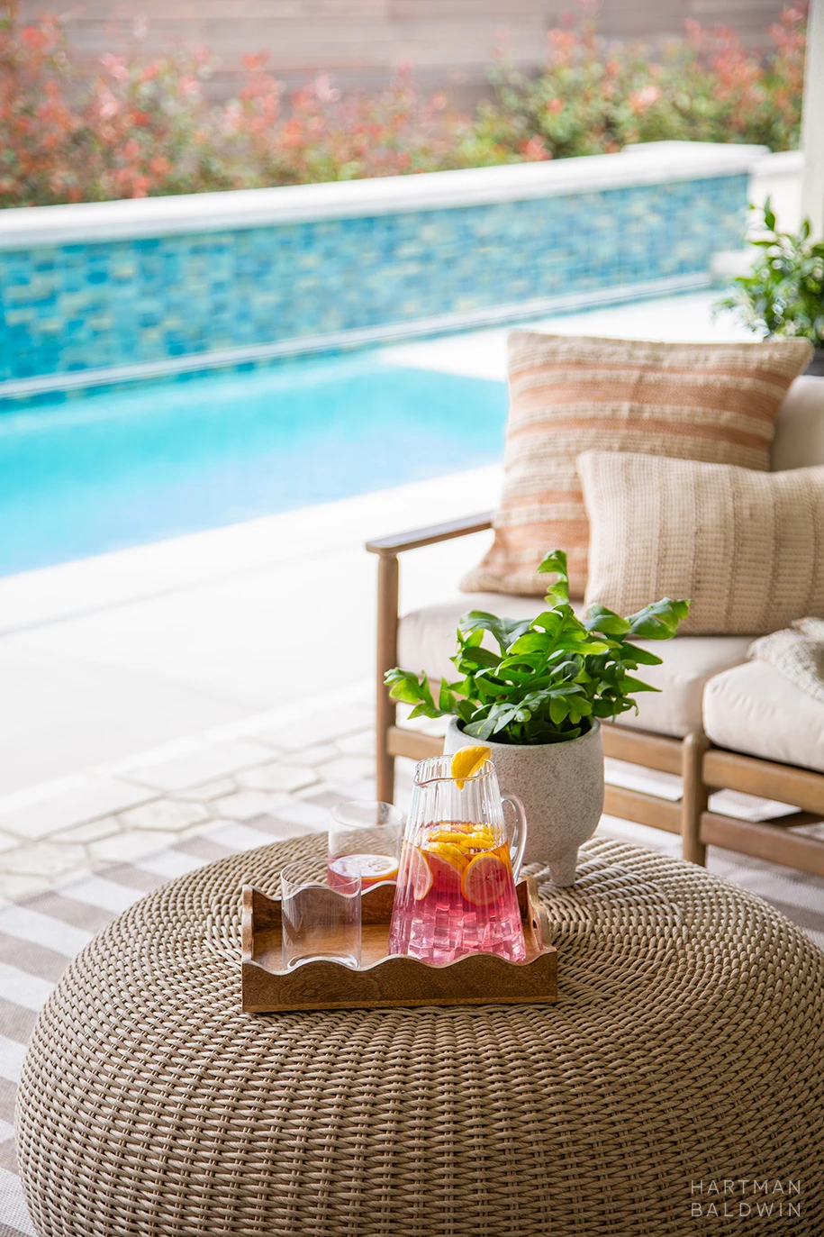HartmanBaldwin Cambridge Residence California Ranch-Style Remodel California Room Detail Backyard patio with outdoor furniture and a new lap pool seen beyond