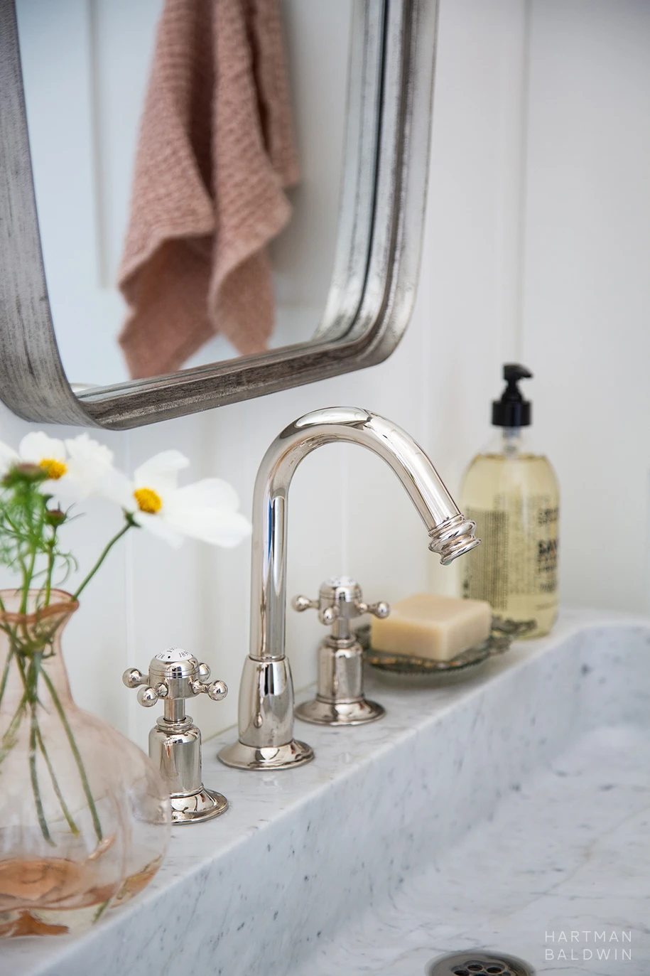HartmanBaldwin Cambridge Residence California Ranch-Style Remodel Bathroom Faucet Detail Bathroom vanity detail with polished nickel faucet and light grey stone sink