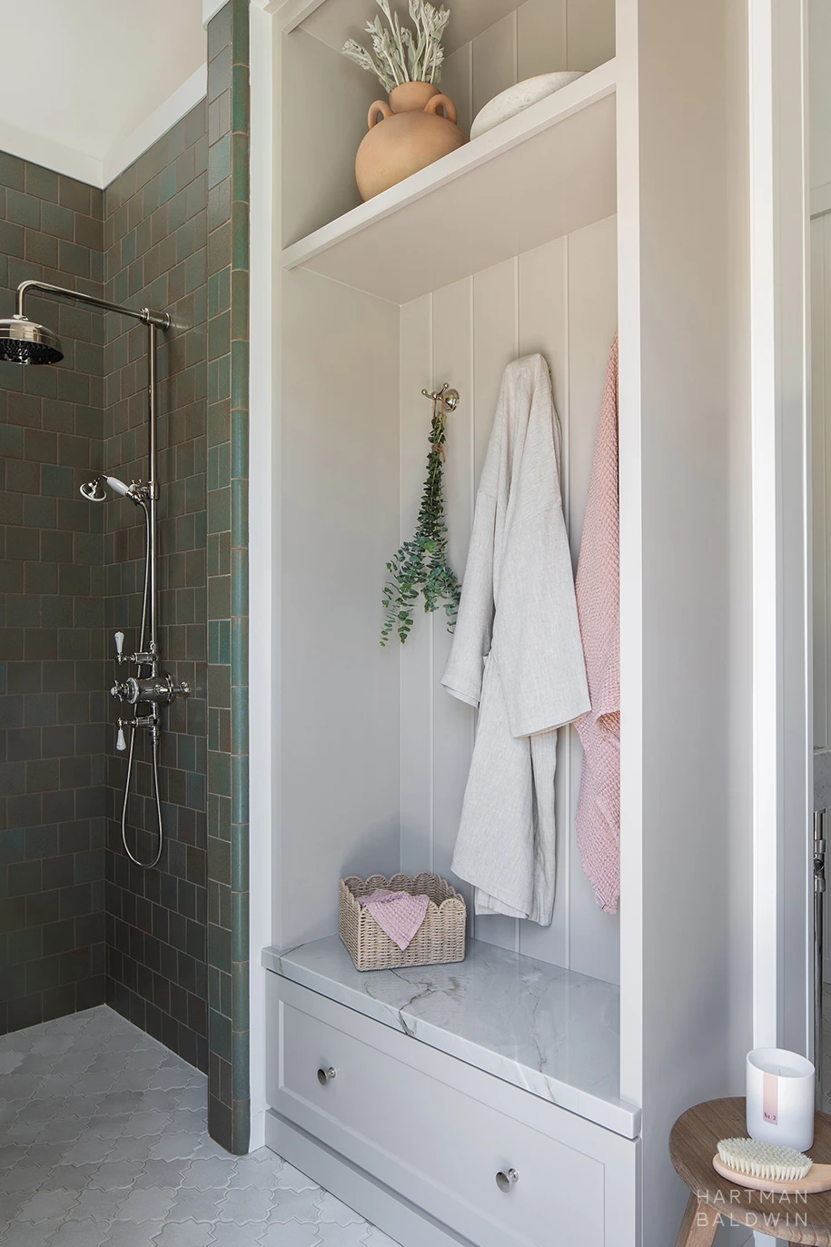 HartmanBaldwin Cambridge Residence Pool Bath Shower and Closet Pool bathroom shower with turquoise green wall tile and adjacent built-in storage cabinet